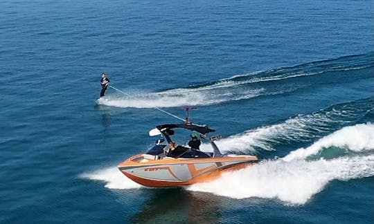 Tige Z1 Wake Boat on Torch Lake, Wakeboard, Surf, Foil, Ski, Tube or Hang for up to 10 people