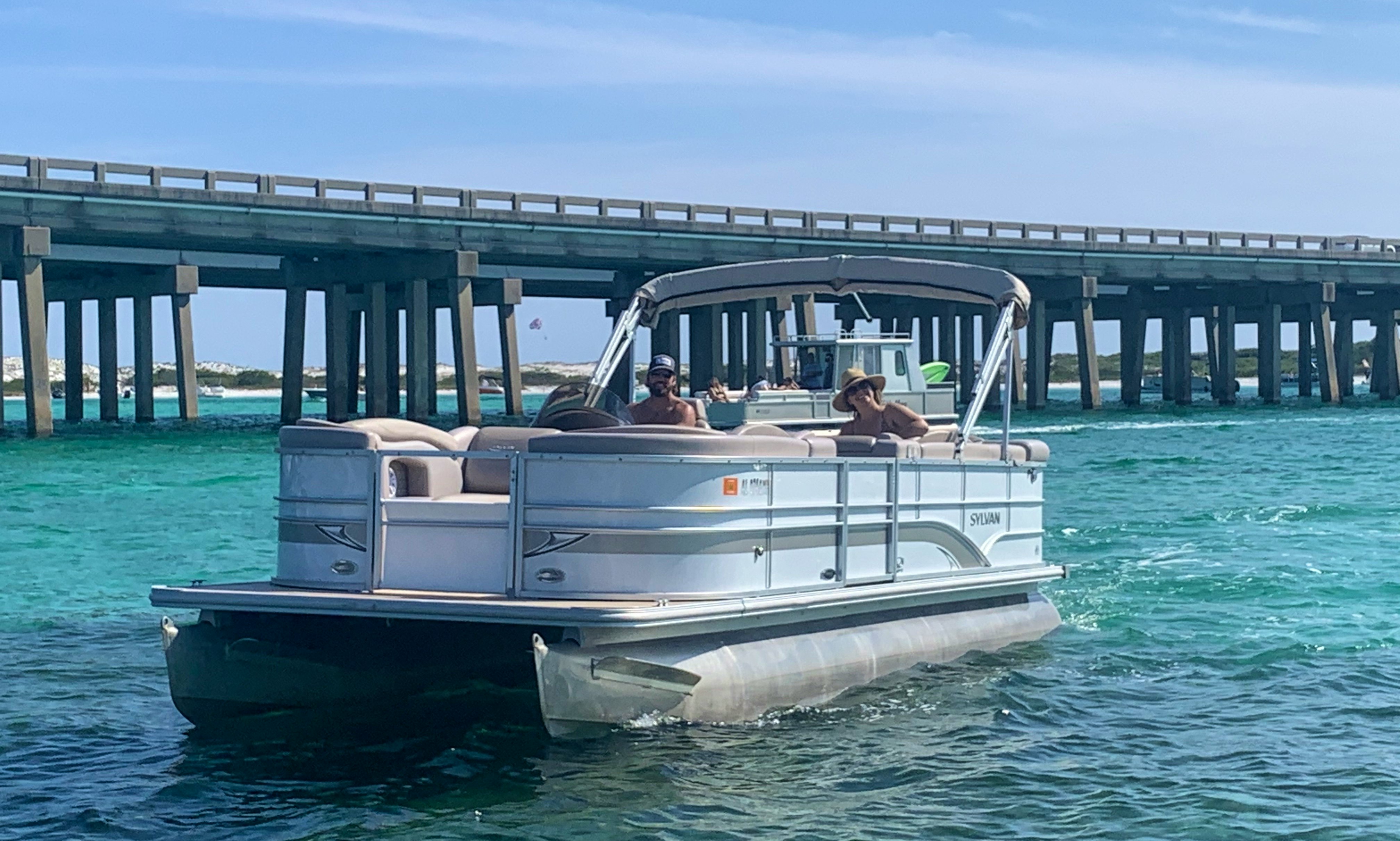 Cruise in Comfort with our 24' Sylvan Pontoon Boat for