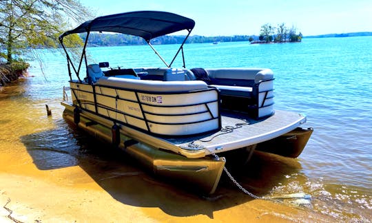 22' Tritoon w/ Bimini Shade Top & Tow Bar for up to 12 guests. Cuts through wake like butter!