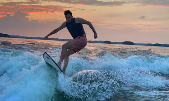 Wake surfing at sunset