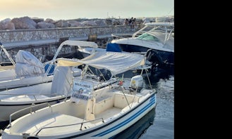 Rent this Center console with Bimini Cover and outboard motor in Livorno, Italy