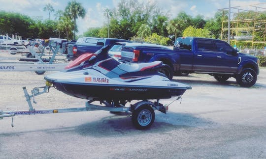 Putting jet ski on the water for client