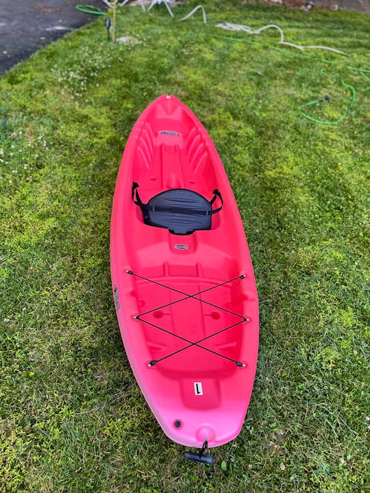 Bright Red 10ft sit on top kayak conveniently located near Brandywine River