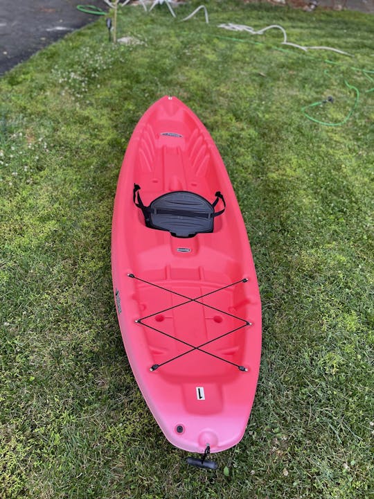 Bright Red 10ft sit on top kayak conveniently located near Brandywine River