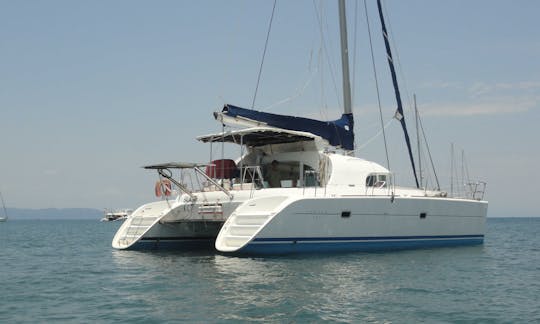 Catamaran Lagoon 380 with crew in le cratère marina, Nosy Be, Madagascar