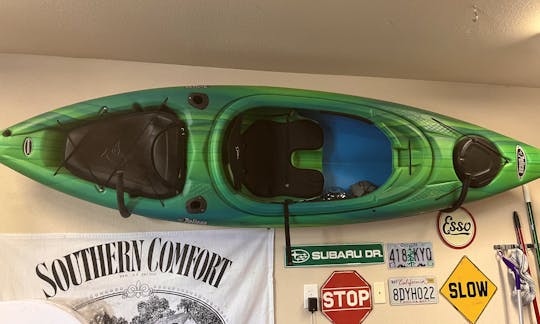Two green kayaks with paddles for rent! Perfect for a date!