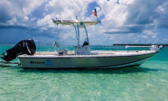 "Piano Piano" Triton 218 Bay Explorer Center Console Rental located in Naples, Florida