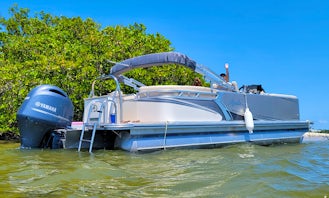 24ft Avalon Tritoon (extra pontoon for increased stability) holds 12 with ski bar and Bluetooth high powered stereo