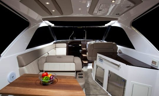 Expansive aft cabin
with grill , icemaker, and refrigerator. sit 6 for dinner.