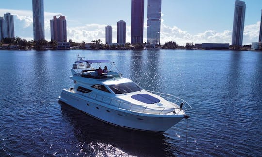 Enjoy The Water With The Famous 60ft Uniesse Fly Bridge Power Mega Yacht in Aventura, Florida