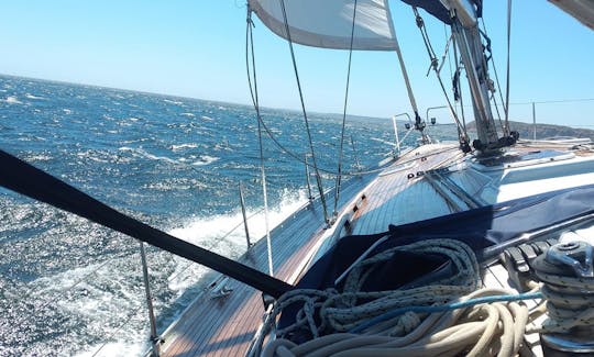 Under lively sail, in the usual afternoon winds of the Western Algarve.