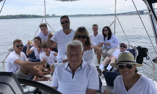 11 Guests Enjoying the Back Deck with grandpa enjoying the Captain‘s Chair