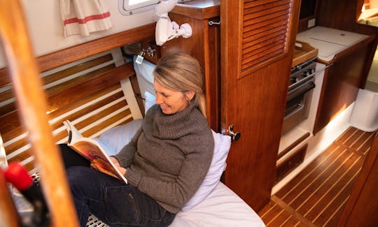 Live-aboard comforts below include a galley, priivate head, sleeping for 4, dining for 6.