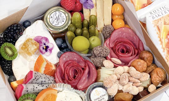 A small Charcuterie box is best for food on the boat.  Pack light and efficient with a beautiful display