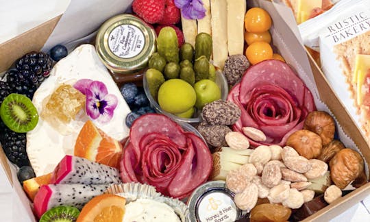 A small Charcuterie box is best for food on the boat.  Pack light and efficient with a beautiful display