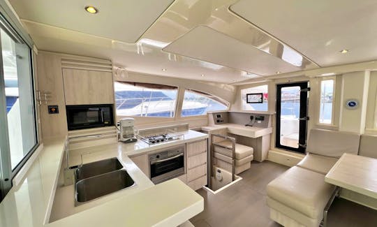 Avalon One - 48' 2016 Leopard Catamaran - Interior Photo of Kitchen/ Seating Area & Dining Room