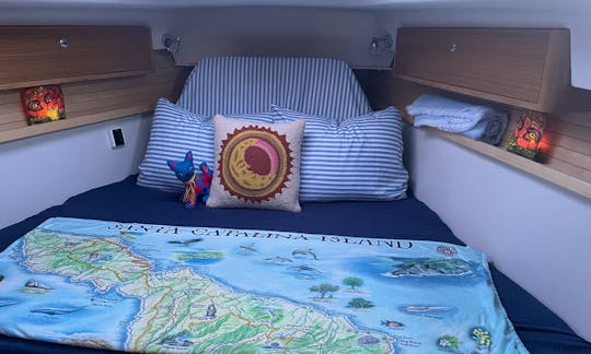 The ensuite main cabin has a centerline queen bed