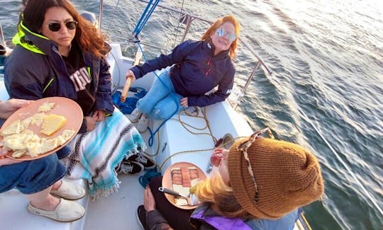 Enjoy each other's company over wine and a snack board while Captain Jenn runs the boat