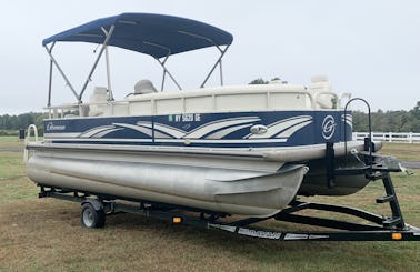 Pontoon boat with skis, wakeboard, 3 person tube & fishing seats!