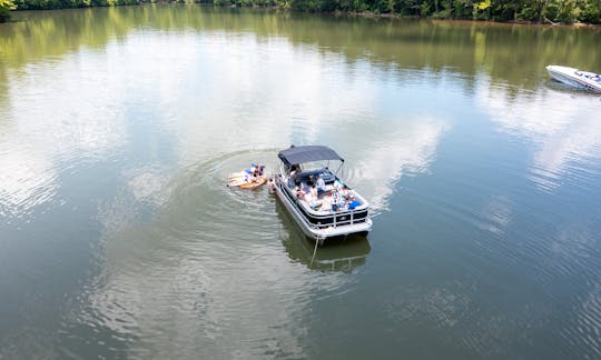 Cruise, swim, party and enjoy on a 2023 Tritoon on Lake Norman!