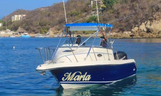 Cruiser Boat for Bay tour with snorkeling in Huatulco Mexico