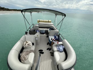 23’ Tritoon Open Sitting in Holmes Beach