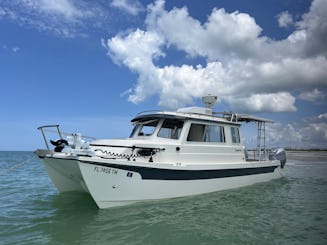 Catamaran Cabin Cruiser de 26 pés comandado por Scott Guttery, nativo da SWFL