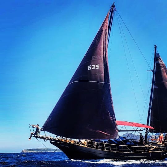 Old pirate sailboat on the coast of Pollença, Mallorca.