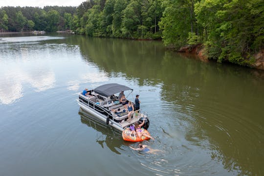 Cruise, swim, party and enjoy on a 2023 Tritoon on Lake Norman!