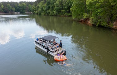 Cruise, swim, party and enjoy on a 2023 Tritoon on Lake Norman!