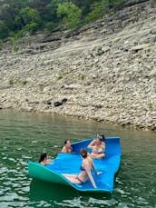 Double Decker Tritoon with Slide in Lake Travis.