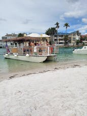 Bateau Tiki St. Pete Pink Pelican - Jusqu'à 18 personnes