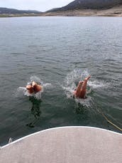 Double Decker Tritoon with Slide in Lake Travis.