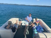 Explore and Enjoy Glen Lake with 2550 RL Bennington Pontoon Boat