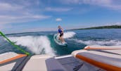 Tige Z1 Wake Boat on Torch Lake, Wakeboard, Surf, Foil, Ski, Tube or Hang for up to 10 people