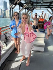 Daytime Club Experience on the Water— Party Boat with Water Toys & Pole Dancing 