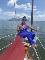 Sail NYC's skyline aboard the Genesis, a beautiful classic sailboat!