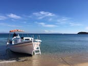 Excursions personnalisées en bateau traditionnel en bois vers la côte sud et Tragonisi ou Delos Rinia