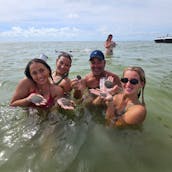 Bateau Tiki St. Pete Pink Pelican - Jusqu'à 18 personnes